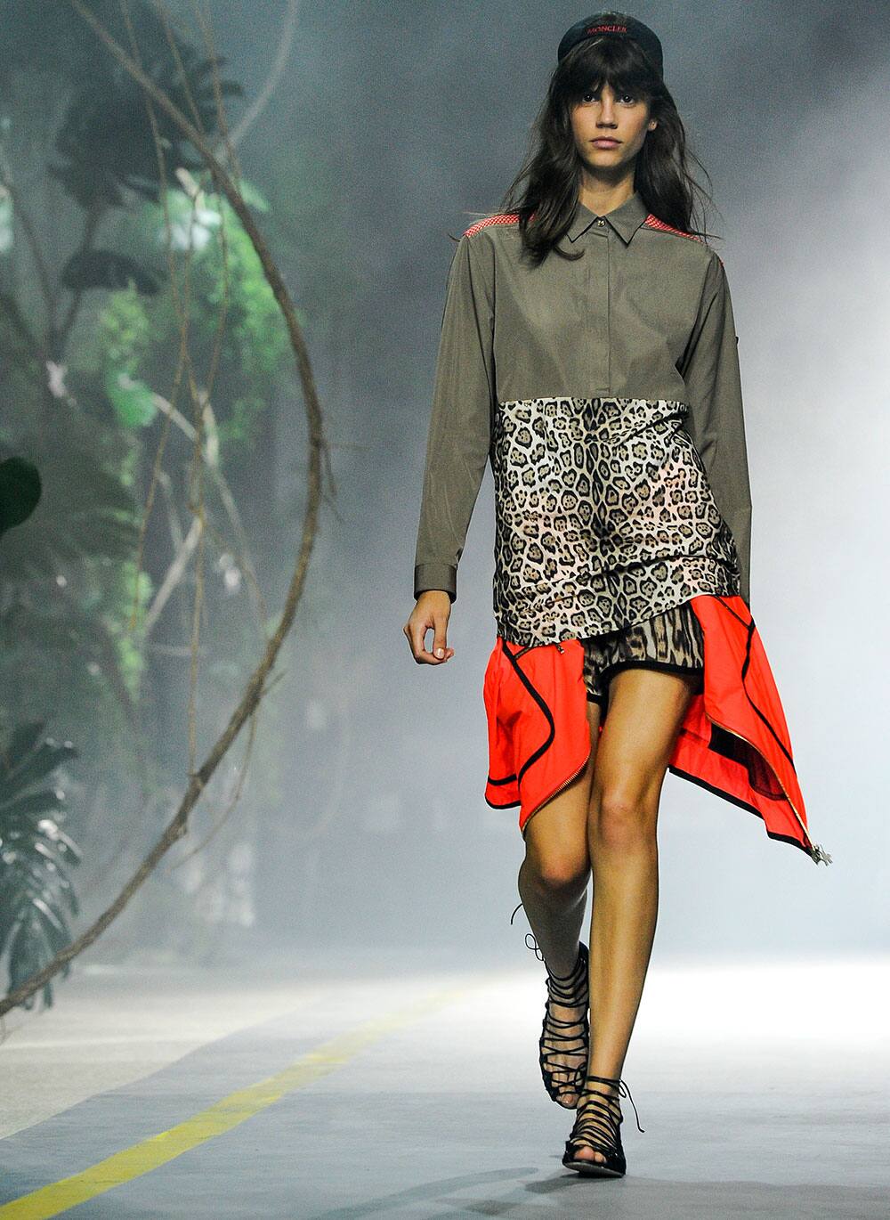 A model wears a creation by Moncler as part of their ready-to-wear Spring/Summer 2014 fashion collection.