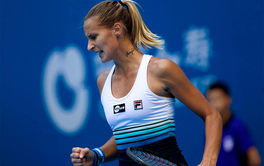 Polona Hercog of Slovenia reacts to a point she won against Ana Ivanovic of Serbia during the China Open tennis tournament.
