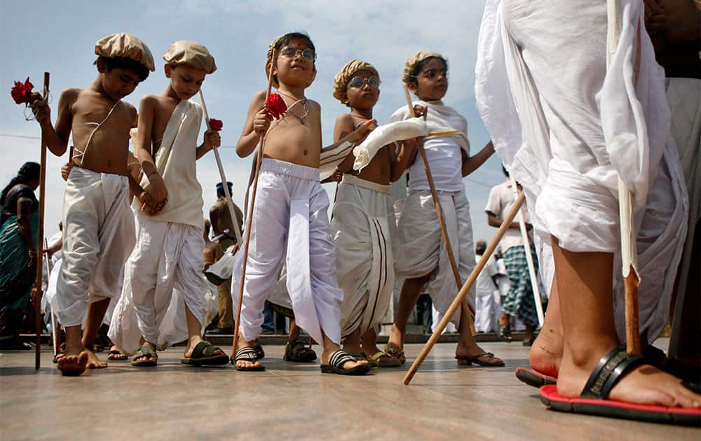 Children dressed as Mahatma Gandhi assemble at an event to mark Gandhi’s birth anniversary in Chennai.