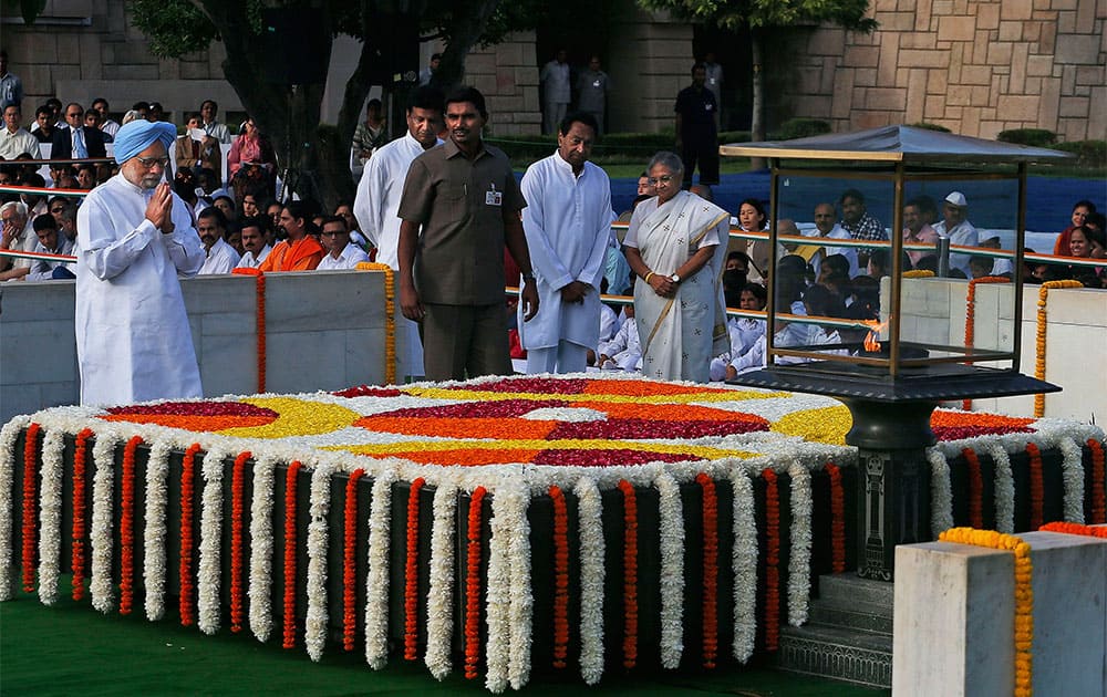 Prime Minister Manmohan Singh offers prayers at a memorial of Mahatma Gandhi on the occasion of his birth anniversary, in New Delhi.