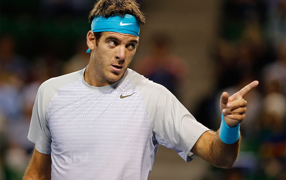 Juan Martin del Potro of Argentina points to a ball boy as he plays a match against his compatriot Carlos Berlocq at the Japan Open Tennis Championships.
