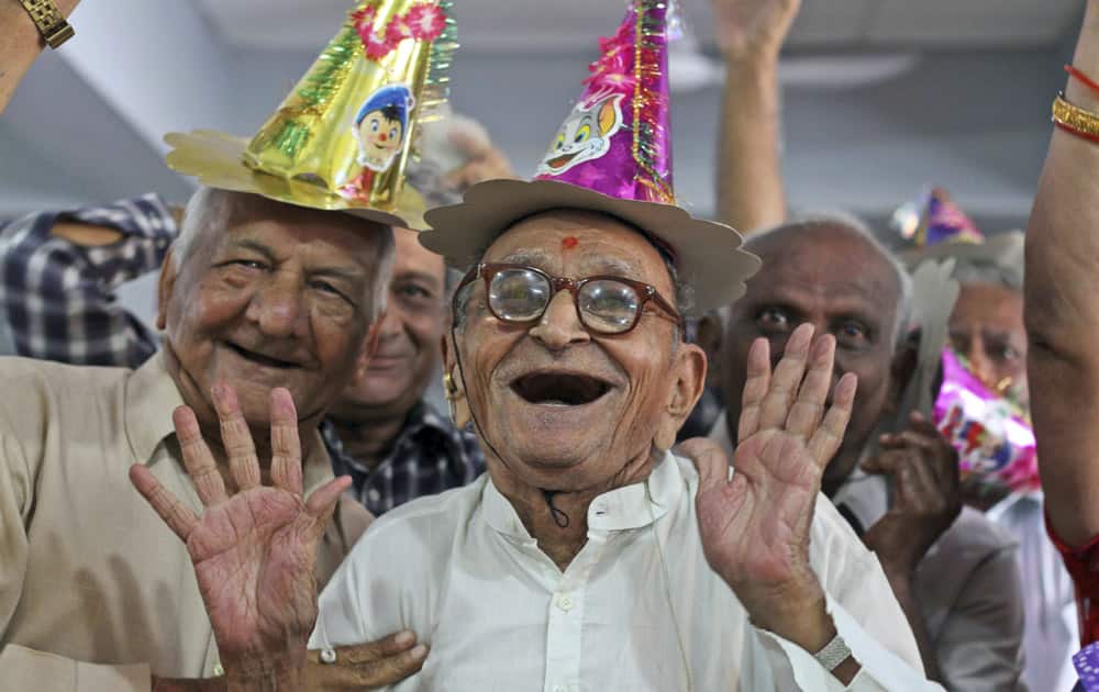 Elderly people participate in celebrations to mark International Day of Older Persons at an old age home in Ahmadabad.