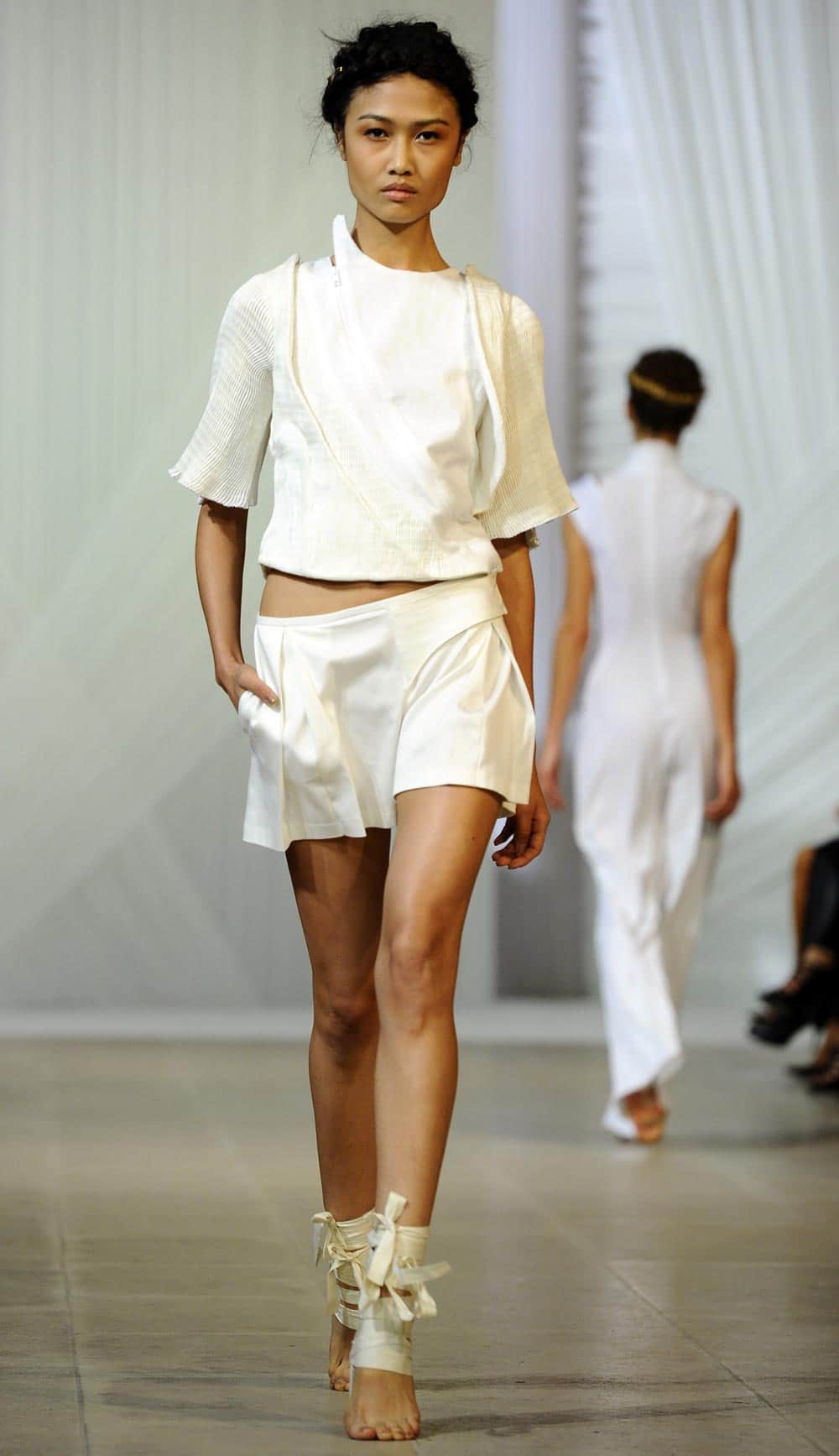 A model presents a creation for Fatima Lopes` ready-to-wear Spring/Summer 2014 fashion collection presented in Paris.