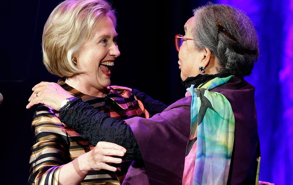 Former Secretary of State, Hillary Rodham Clinton embraces Children`s Defense Fund president Marian Wright Edelman, during a performance where Clinton was honored at the 40th anniversary celebration of the Children`s Defense Fund at the John F. Kennedy Center for the Performing Arts, in Washington.