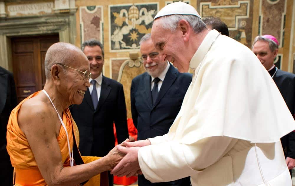 Pope Francis meets with an unidentified representative of a different religion participating in an international meeting for peace, at the Vatican.