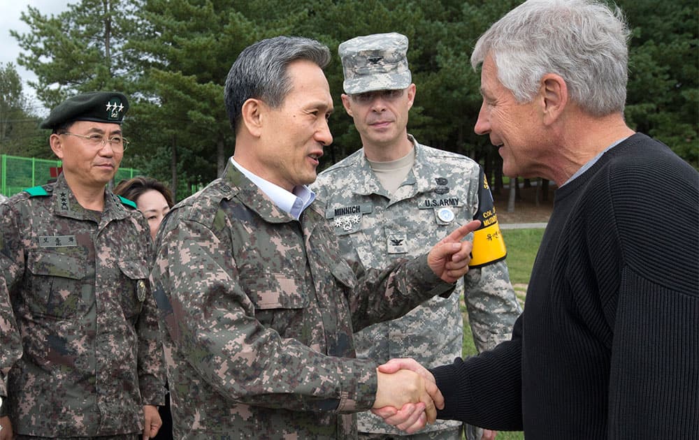 US Secretary of Defense Chuck Hagel, right, is greeted by South Korean Defense Minister Kim Kwan-jin, before a tour of the Demilitarized Zone (DMZ), the military border separating the two Koreas, in Panmunjom, South Korea.