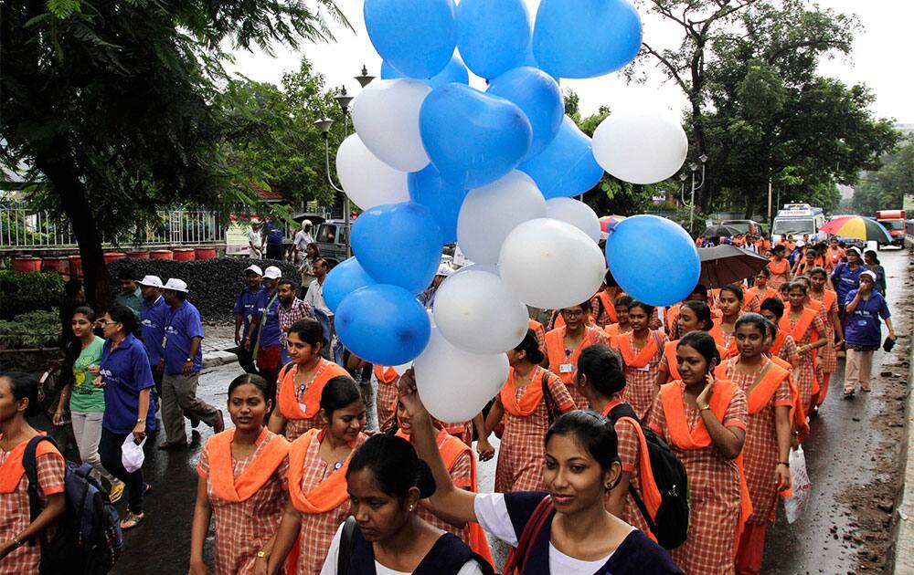Paramedics, students and others join an awareness rally to fight against cardiovascular disease on World Heart Day in Kolkata.