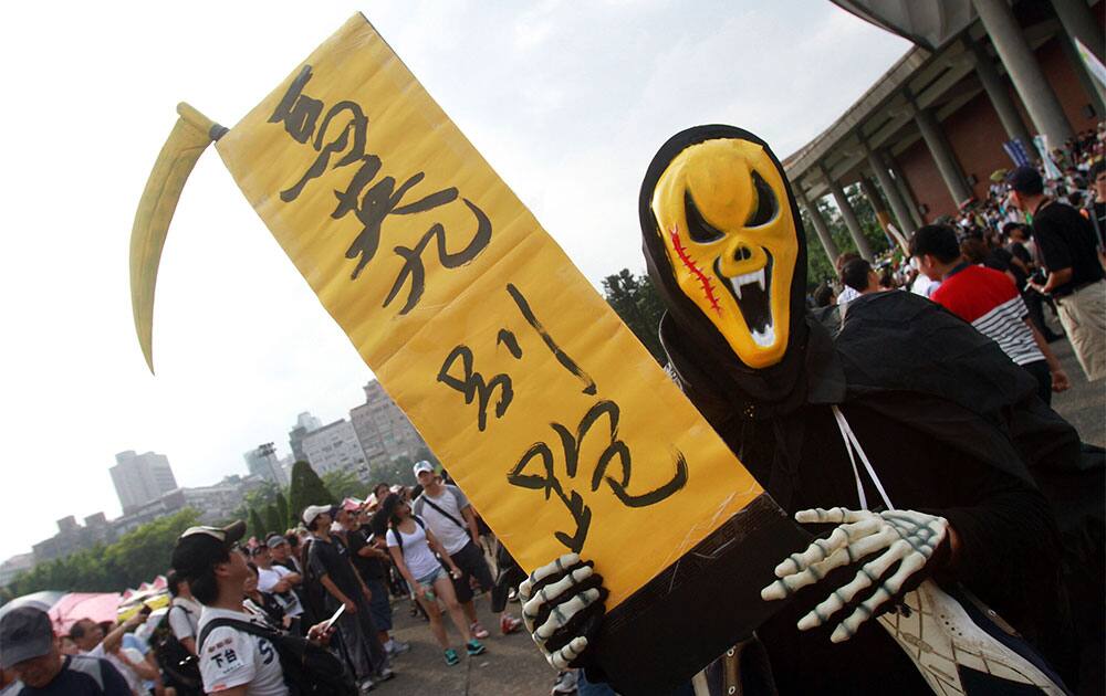 A protester holds a slogan reading