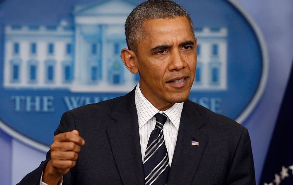 President Barack Obama gestures while making a statement regarding the budget fight in Congress and foreign policy challenges, in the James Brady Press Briefing Room of the White House in Washington.