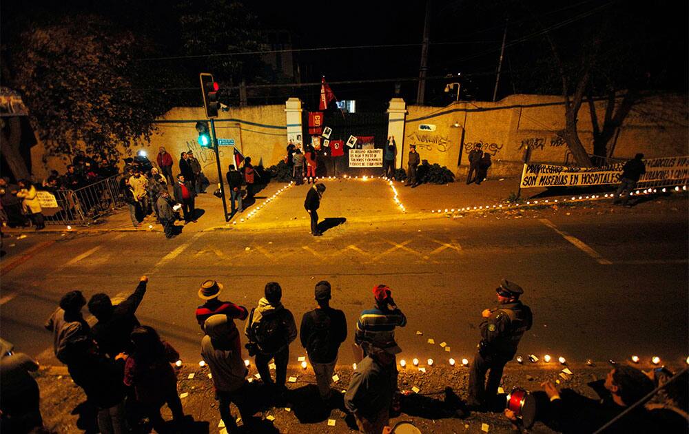 Chileans gather outside the entrance of the Cordillera prison during a protest against the luxurious conditions at the prison, in Santiago, Chile.