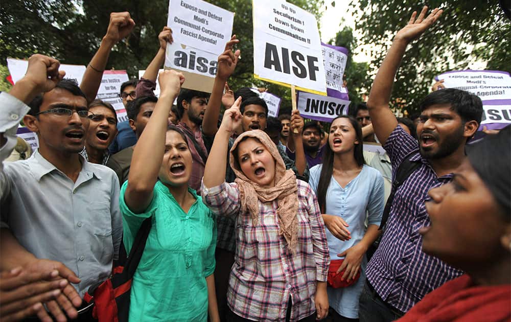 Indian student activists shout slogans during a protest against recent communal riots and Bharatiya Janata Party leader Narendra Modi’s Sunday rally in New Delhi.