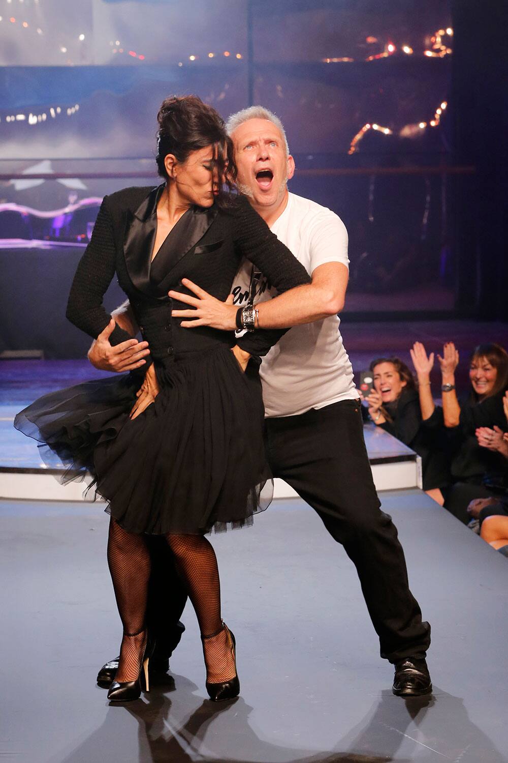 Fashion designer Jean-Paul Gaultier, right, and choreographer Blanca Li perform a dance, following the presentation of Gaultier`s ready-to-wear Spring/Summer 2014 fashion collection.
