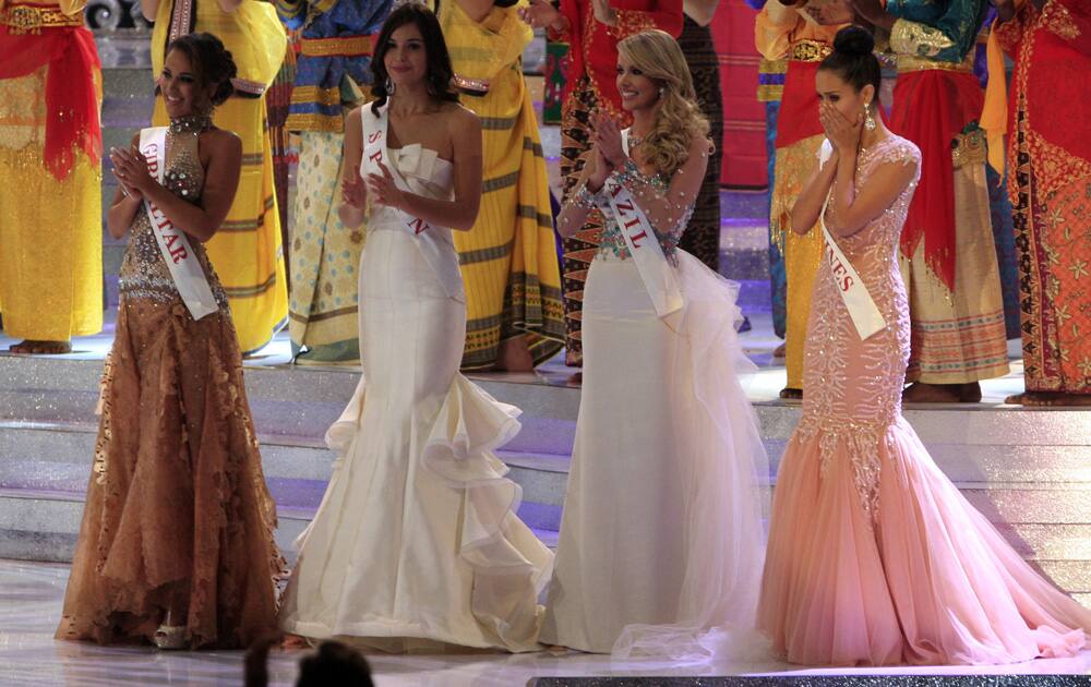 Miss Philippine Megan Young, right, reacts after winning the Miss World pageant final in Nusa Dua, Bali, Indonesia.