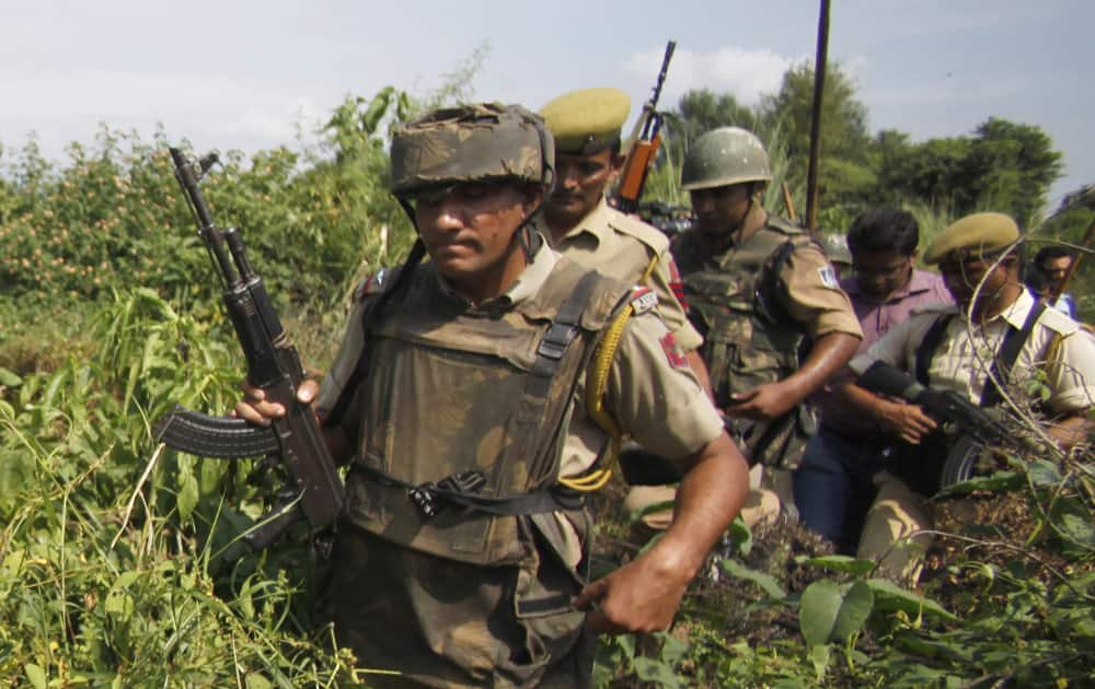 Indian policemen patrol the Chajarth forest area in Kathua, about 60 kilometers (38 miles) from Jammu. Security forces have launched a massive search operation in the area after villagers claimed they sighted terrorists.