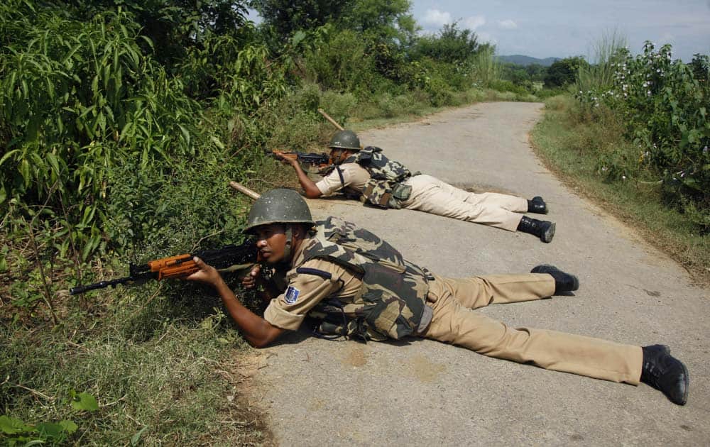 Paramilitary soldiers take a position during a search operation in the Chajarth forest area in Kathua, about 60 kilometers (38 miles) from Jammu.