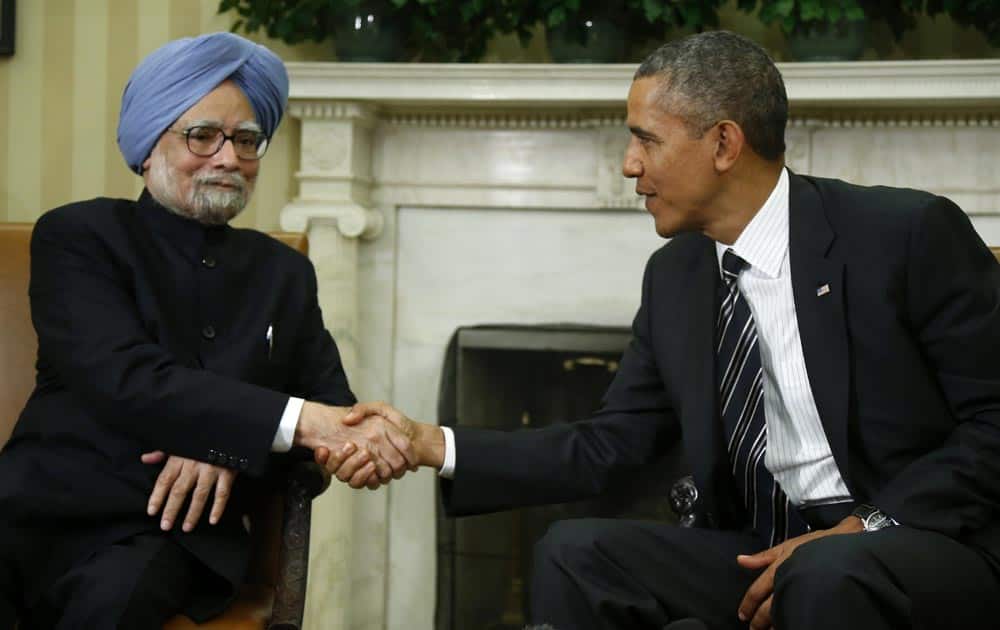President Barack Obama shakes hands with Prime Minister Manmohan Singh in the Oval Office of the White House in Washington.