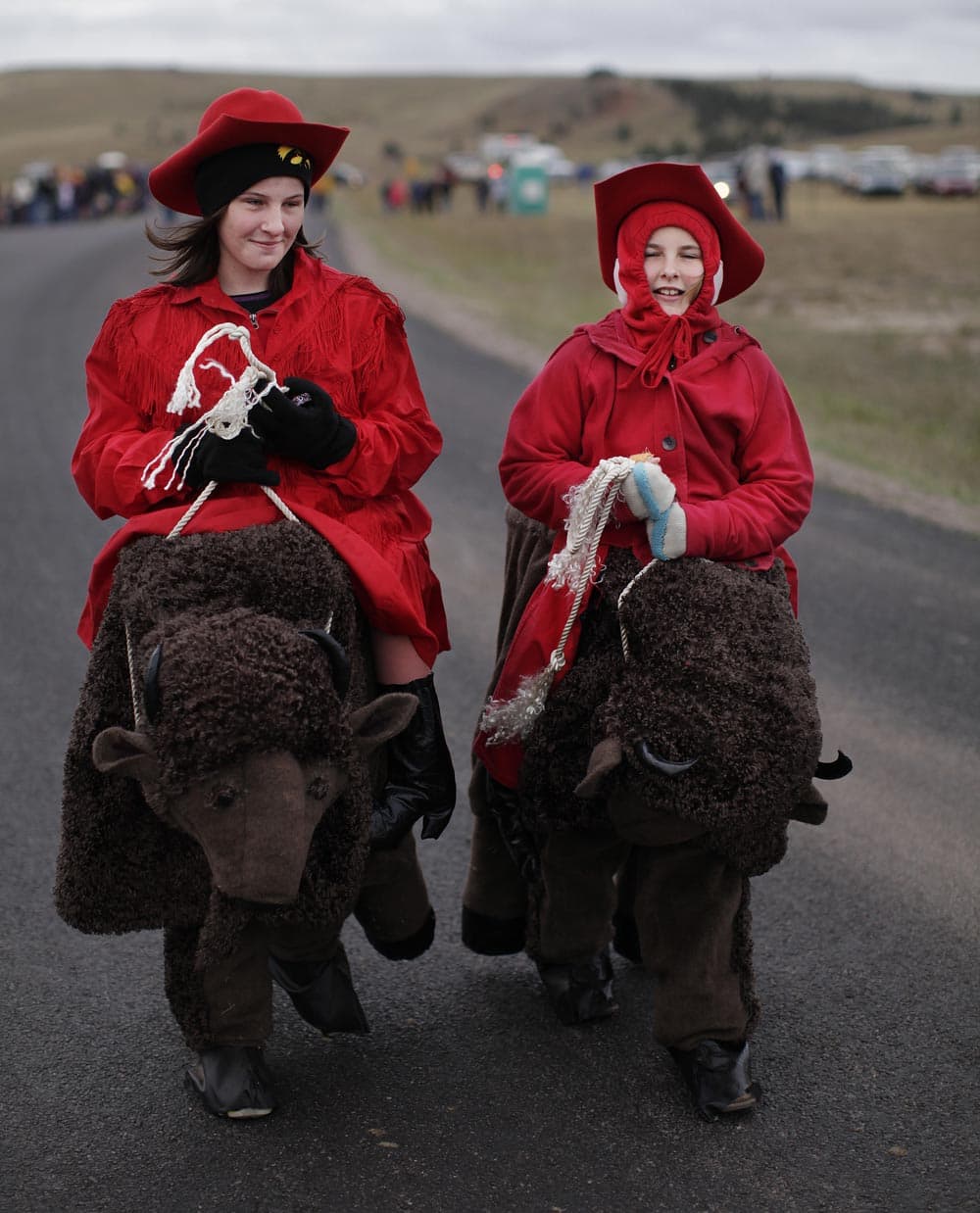 Catherine Neihart, 12, left, and her sister, Jessalee, 10, from Braddyville, Iowa, wear buffalo costumes made by their grandmother during the 48th Buffalo Roundup in Custer State Park, in Custer.