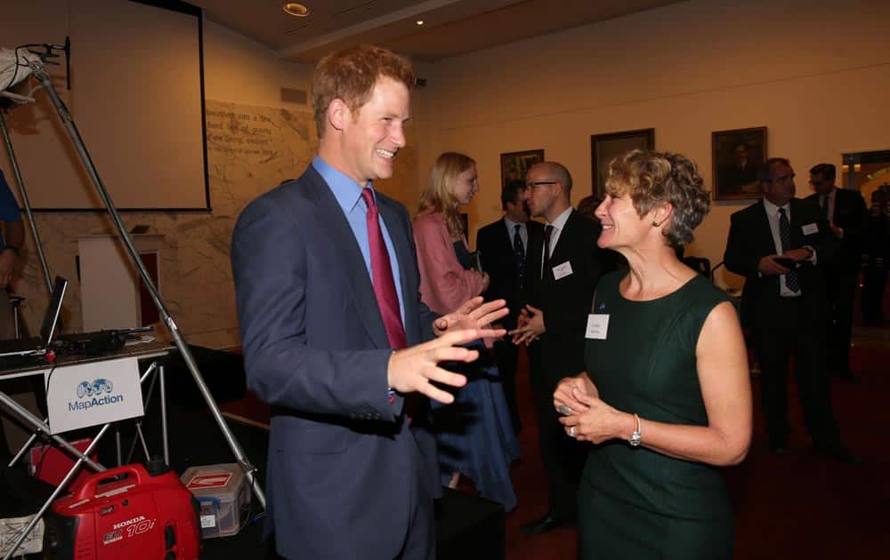 Britain`s Prince Harry, with Chief Executive, Liz Hughes, at a reception for MapAction at the Royal Society, in central London.