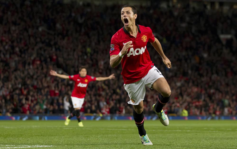 Manchester United`s Javier Hernandez celebrates after scoring against Liverpool during their English League Cup soccer match at Old Trafford Stadium, Manchester, England.