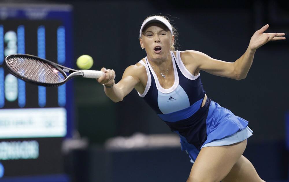 Caroline Wozniacki of Denmark returns the ball against Lucie Safarova of the Czech Republic during their quarterfinal match of the Pan Pacific Open tennis tournament in Tokyo.
