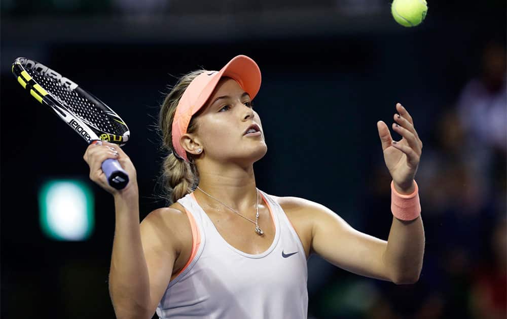 Eugenie Bouchard of Canada juggles a ball after losing a point against Venus Williams of the US during their quarterfinal match of the Pan Pacific Open tennis tournament in Tokyo.