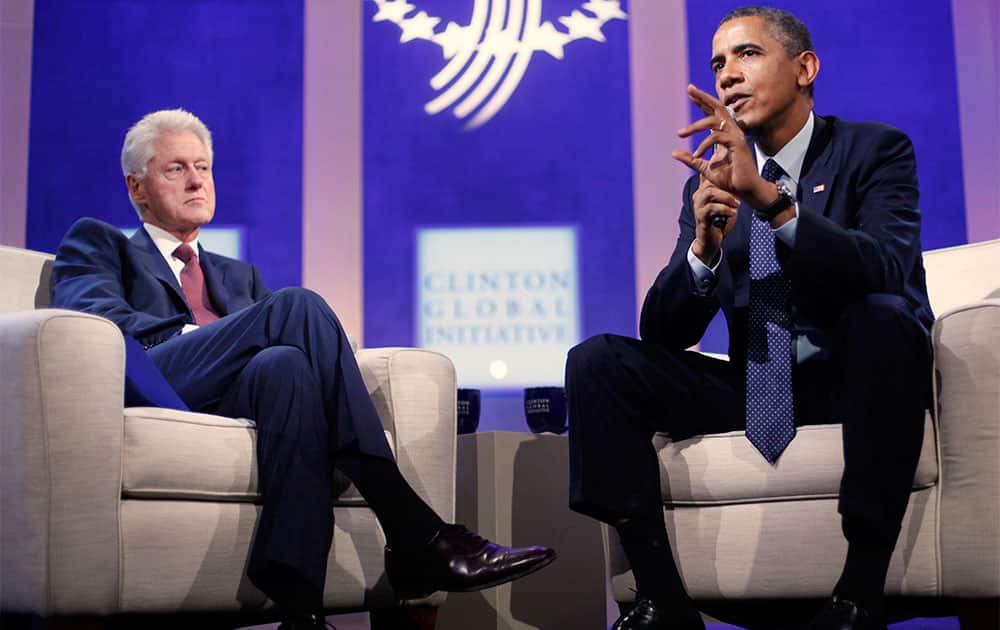 President Barack Obama with former President Bill Clinton speaks at the Clinton Global Initiative in New York.