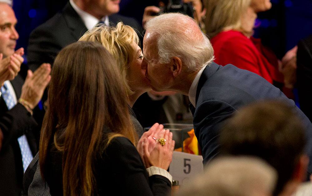Vice President Joe Biden kisses former U.S. Secretary of State, Hillary Rodham Clinton, as he arrives at the Clinton Global Initiative`s Citizen Awards Dinner in New York.