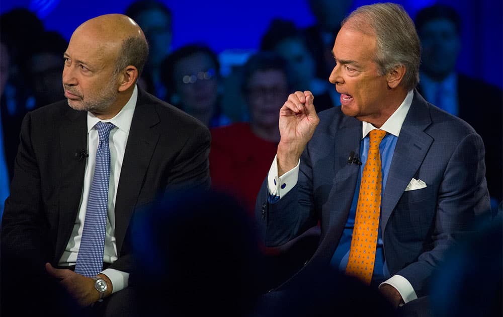 Lloyd Blankfein, left, Chairman and CEO of Goldman Sachs, and Jim Rogers, CEO of Duke Energy participate during the panel discussion