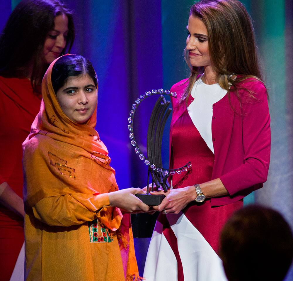 Malala Yousafzai, the Pakistani teenager shot by the Taliban for promoting education for girls, is given Leadership in Civil Society award by Queen Rania of Jordan at the Clinton Global Initiative`s Citizen Awards Dinner, in New York.