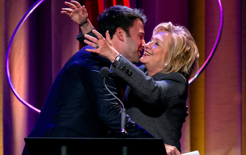 Former Secretary of State Hillary Rodham Clinton embraces actor Ben Affleck at the Clinton Global Initiative`s Citizen Awards Dinner, in New York.