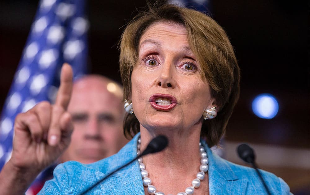 House Minority Leader Nancy Pelosi of Calif., accompanied by Democrat leaders in the House of Representatives, gestures during a news conference on Capitol Hill in Washington, Wednesday, Sept. 25, 2013, to appeal to Republicans to not play politics with upcoming negotiations on the federal debt limit.