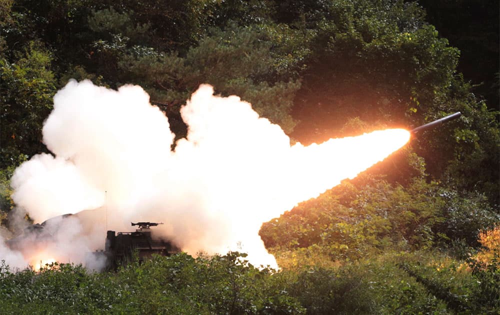 A rocket is fired from a US Multiple Launch Rocket System vehicle during an US military exercise near the demilitarized zone (DMZ) that separates the two Koreas since the Korean War, in Cheorwon, South Korea.