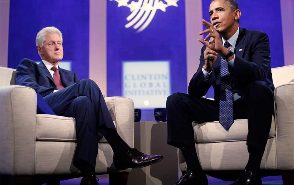 President Barack Obama with former President Bill Clinton speaks at the Clinton Global Initiative in New York.