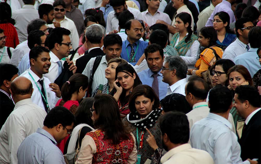 People rush out their offices after they felt a major earthquake that struck Baluchistan province in southwest Pakistan.