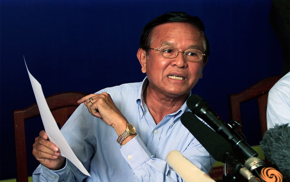 Cambodia National Rescue Party`s Vice President Kem Sokha shows a document letter during a press conference at his party`s headquarters in Phnom Penh, Cambodia.
