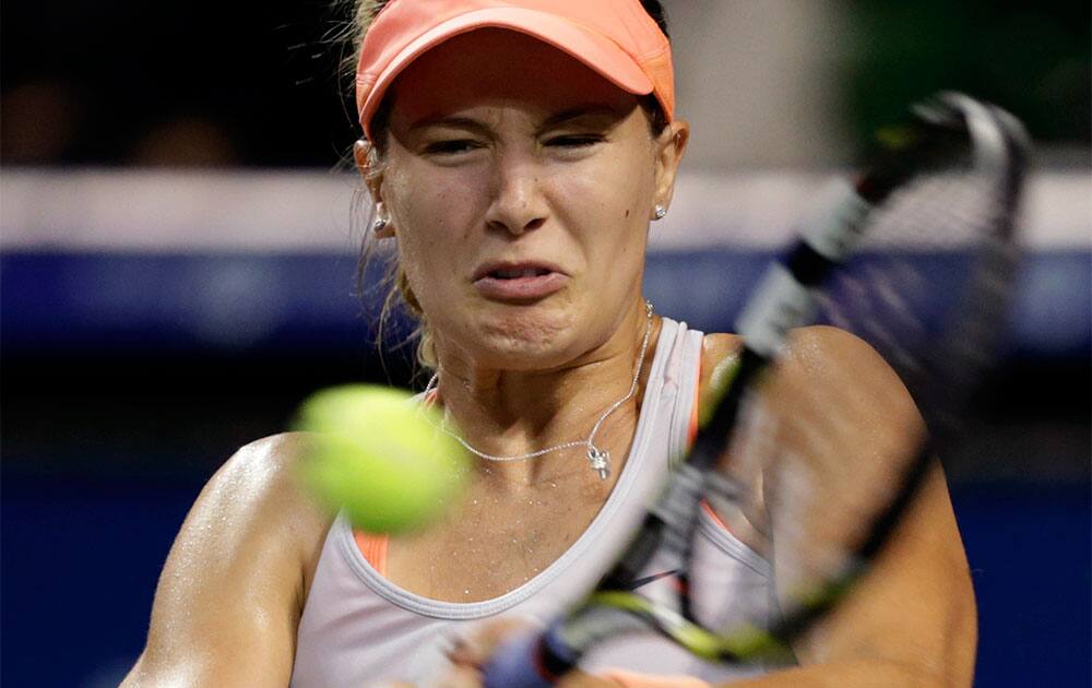 Eugenie Bouchard of Canada returns the ball against Serbia`s Jelena Jankovic during their third round match of the Pan Pacific Open tennis tournament in Tokyo.