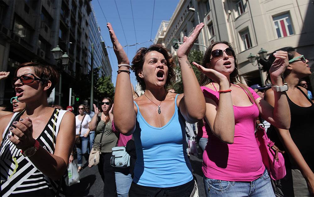Protesters chant slogans during a protest in central Athens. Greek civil servants walked off the job Tuesday at the start of a 48-hour public sector strike, the second in as many weeks, to protest job cuts required for the country to continue receiving international rescue loans.