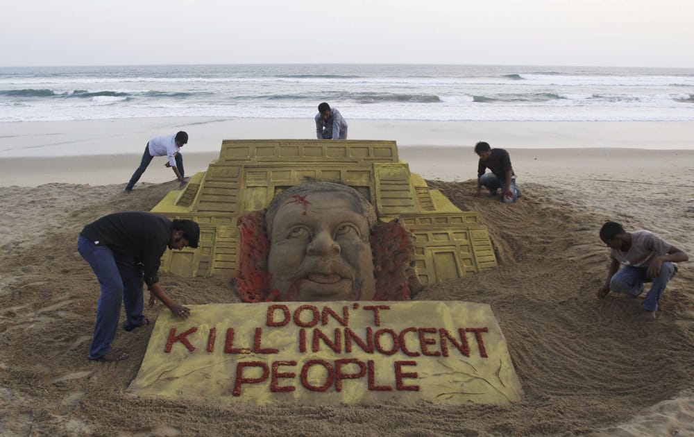 Sand artist Sudarshan Pattnaik and his team pay tributes to the victims of the terror attack on a Kenya mall by creating a sand sculpture on the Bay of Bengal coast in Puri.