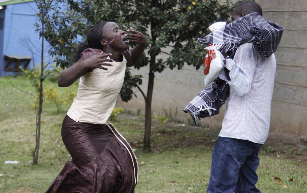 Ann Gakii reacts at the Nairobi City Mortuary after identifying the body of her father, who was killed in the mall attack, in Nairobi, Kenya