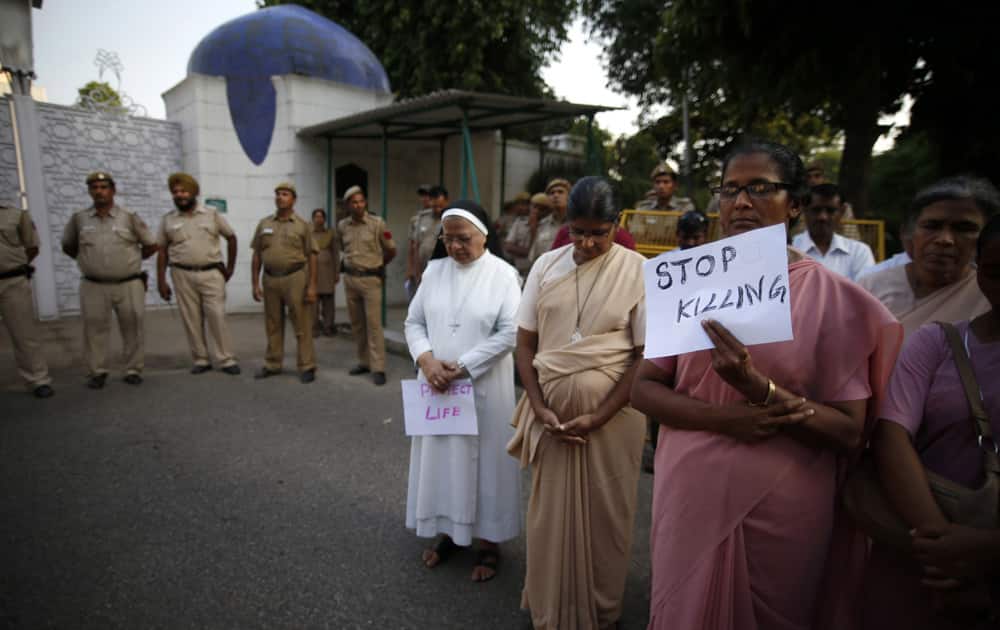 Indian Christians hold placards to condemn Sunday’s suicide attack on a church in Pakistan, during a protest outside the Pakistani embassy in New Delhi.