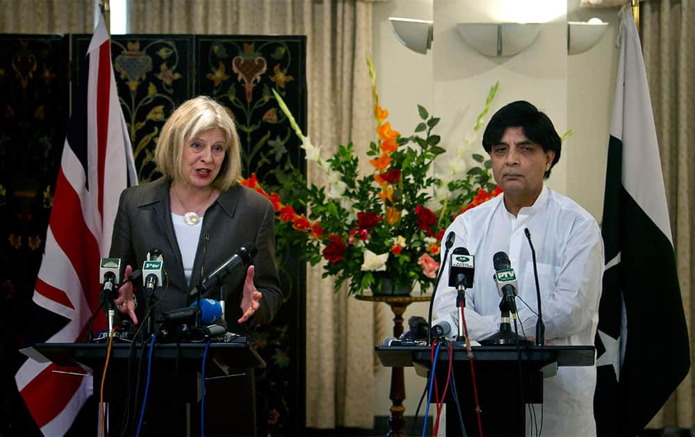 United Kingdom Home Secretary Theresa May, left, speaks during a joint press conference with Pakistani Interior Minister Chaudhry Nisar Ali, right, in Islamabad, Pakistan.