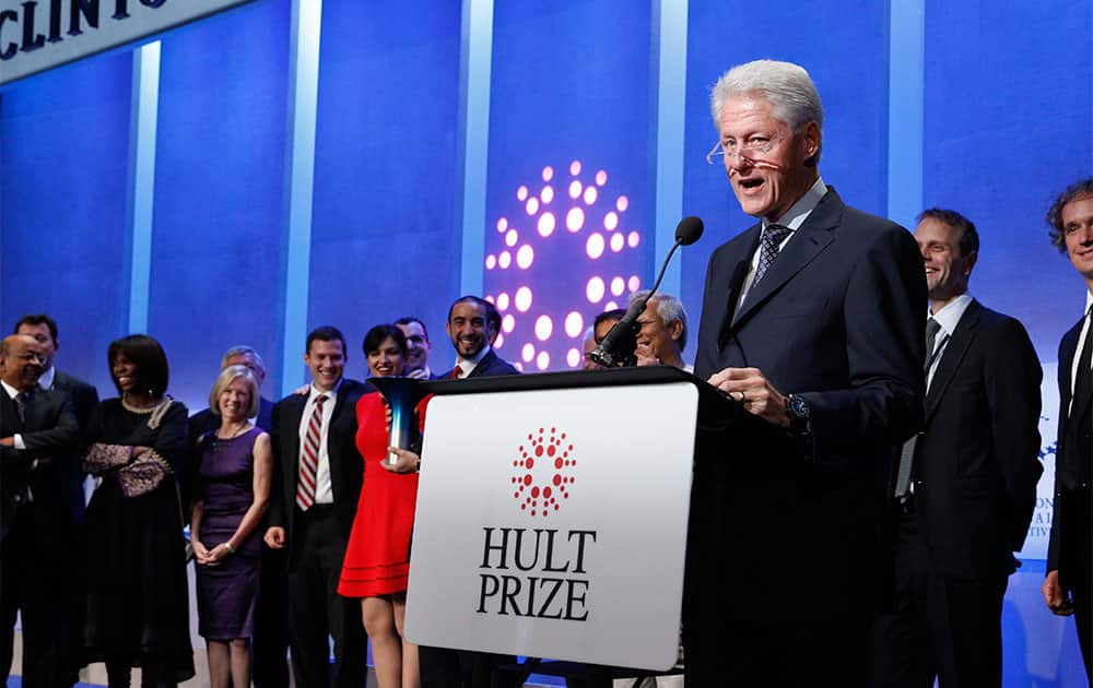 Former president Bill Clinton onstage with the winners of The Hult Prize on the first day of his annual CGI meeting in New York.