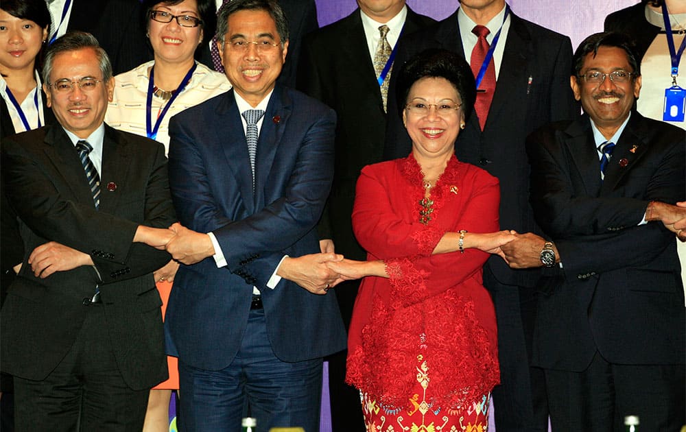 Health ministers pose for a group photo at the Asia-Pacific Economic Cooperation high level meeting on Health and the Economy in Bali, Indonesia.