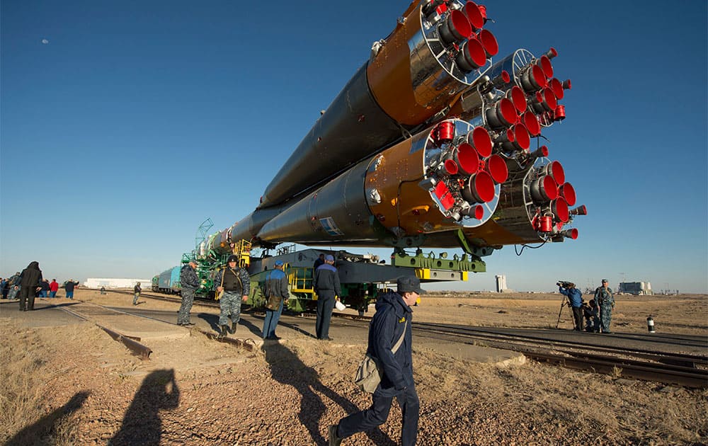 In this photo provided by NASA, the Soyuz rocket is rolled out to the launch pad by train, at the Baikonur Cosmodrome in Kazakhstan.