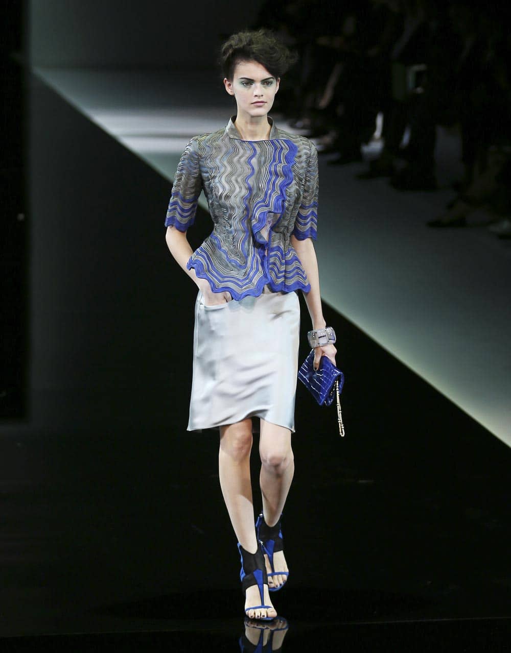 A model wears a creation for Giorgio Armani`s women`s Spring-Summer 2014 collection, part of the Milan Fashion Week.