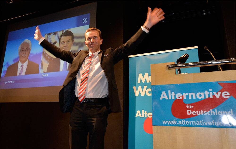 Alternative for Germany (AfD) top candidate Bernd Lucke reacts to supporters late in the evening at the party`s election event in Berlin.