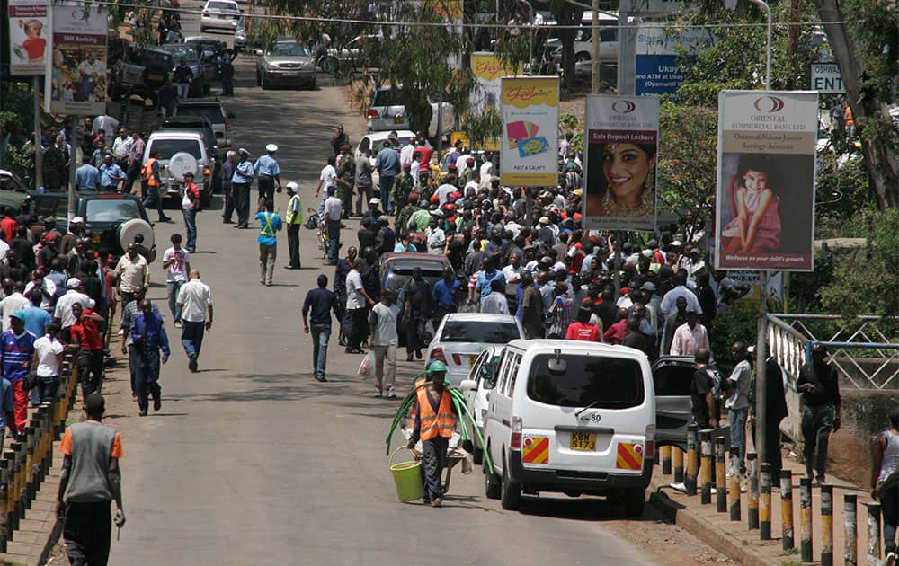 Crowds gather outside the Westgate Mall, an upscale shopping mall in Nairobi, Kenya, where shooting erupted when armed men staged an attack.