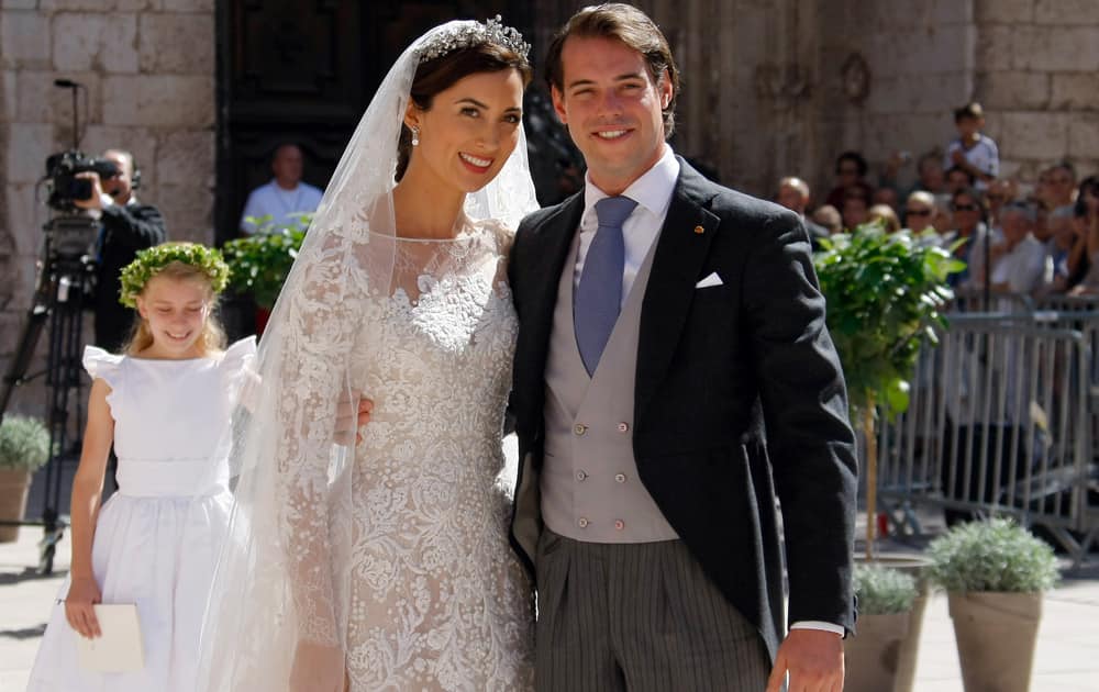 Prince Felix of Luxembourg and his wife Claire Lademacher pose for photographers after their church wedding in Saint-Maximin-La-Sainte-Baume, southern France.