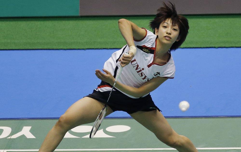 Shizuka Uchida of Japan returns a shot against Wang Yihan of China during their women`s semifinal match of the Japan Open badminton championships in Tokyo.