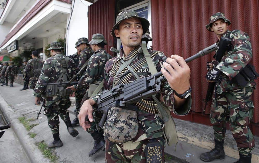 Government troopers patrol to secure the city streets as fighting between government forces and Muslim rebels continues, in Zamboanga city, in Philippines.